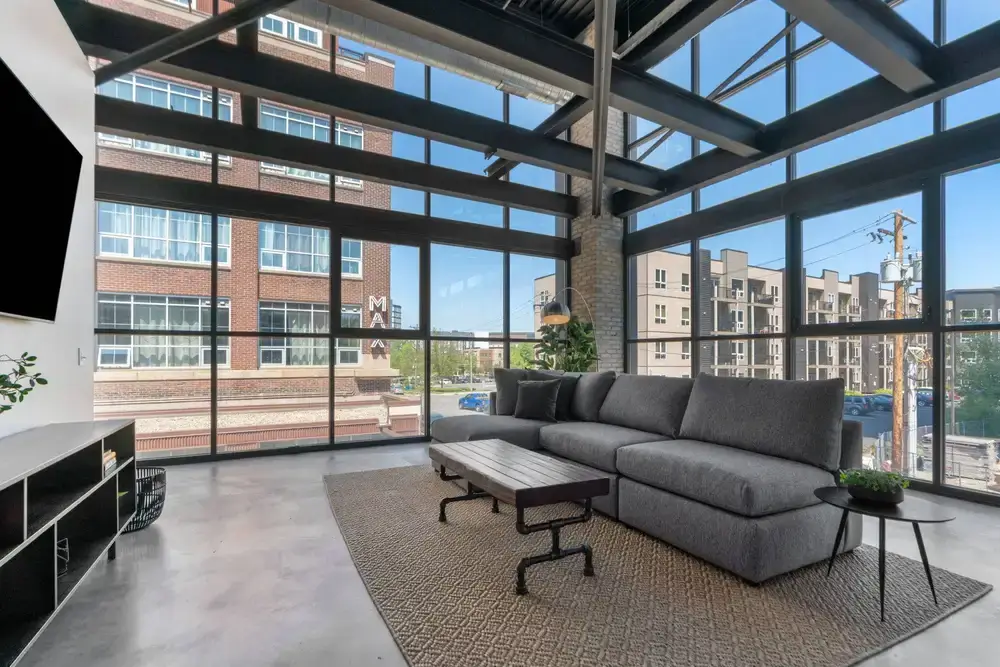 A modern and stylish loft apartment with large windows