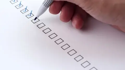 A person checking items off a list